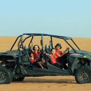 Happy family exploring the Dubai desert with an off-road buggy, creating fun and lasting memories.